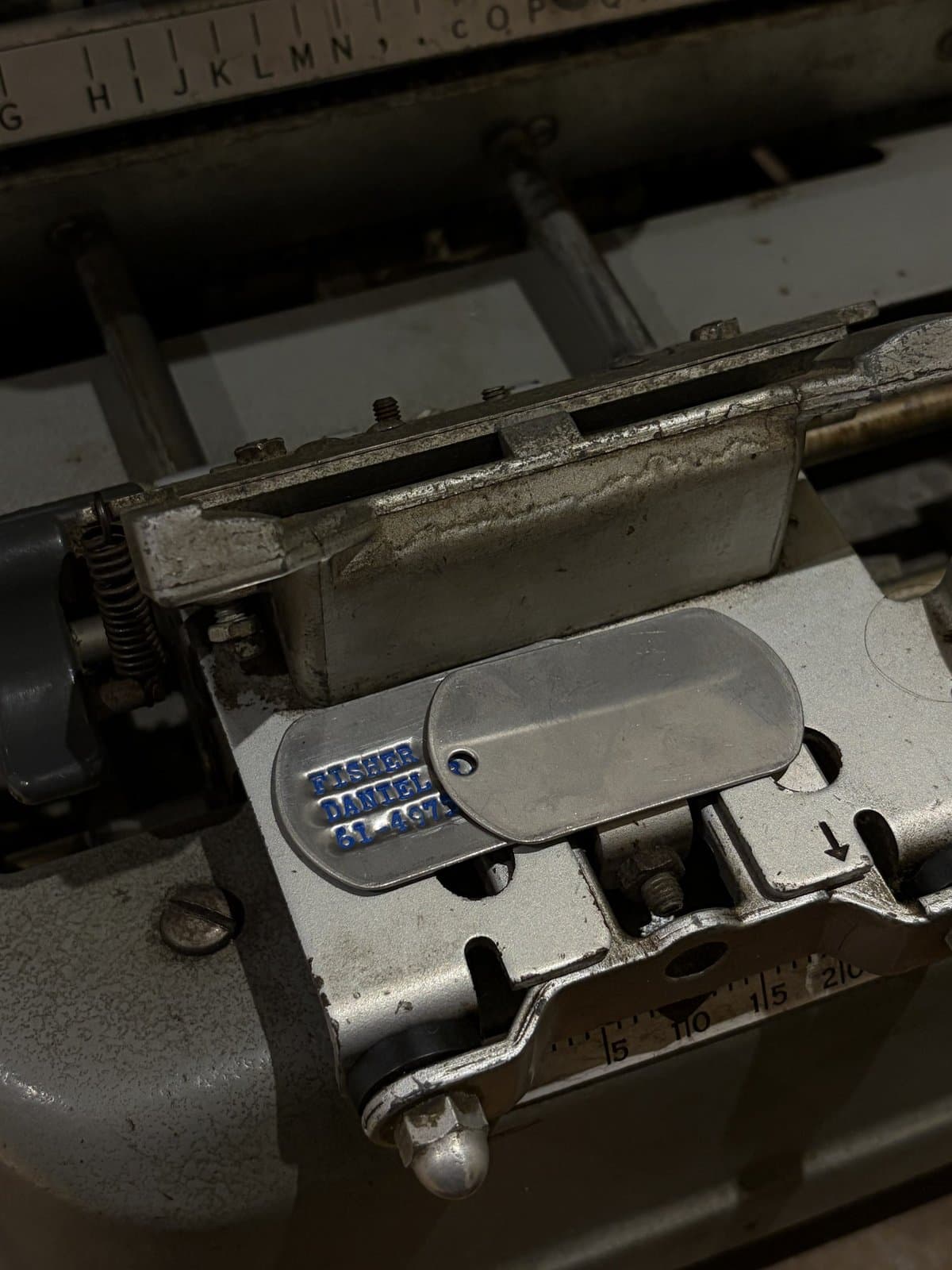 Stainless dog tags on the Graphotype press in Brisbane
